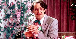 Steve Buscemi crying and clapping while holding a drink