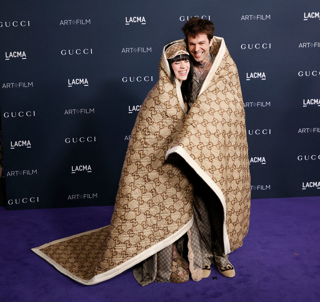 Billie Eilish and Jesse Rutherford wrapped in a Gucci blanket
