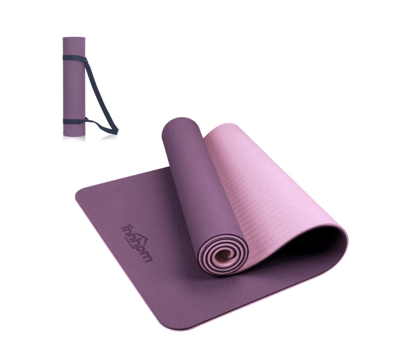 There&#x27;s the purple yoga mat has a light pink underside and a stamped logo and a smaller rolled up mat with black straps