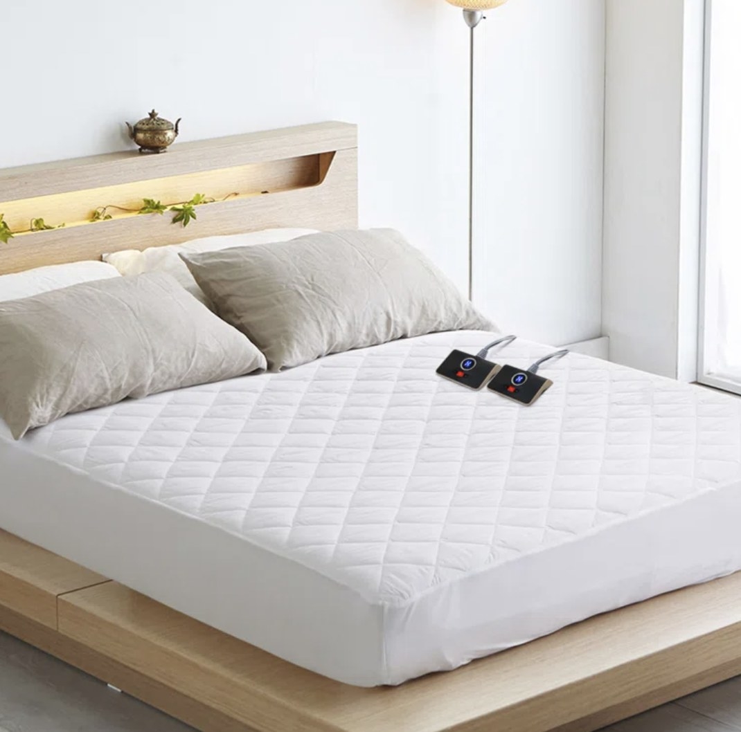 The white mattress has two heater controls on top