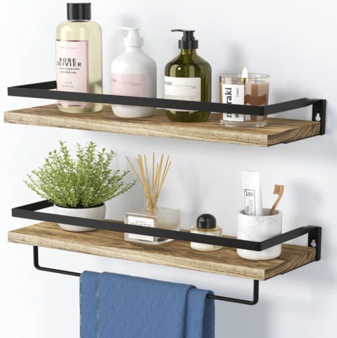 There are two floating shelves with light wood and black metal detailing