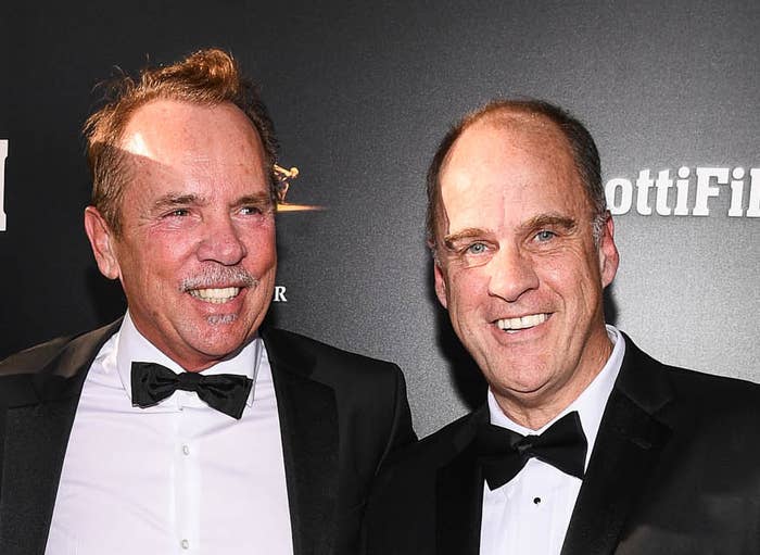 Both men wearing bow ties and smiling