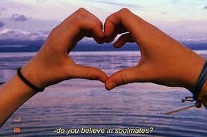 a couple making a heart with their hands <3