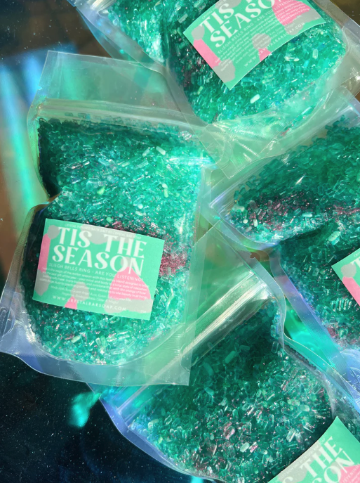 a bag of green crystal infused bath salts