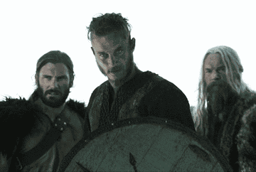 Three vikings descend into a meeting space while examining their hosts