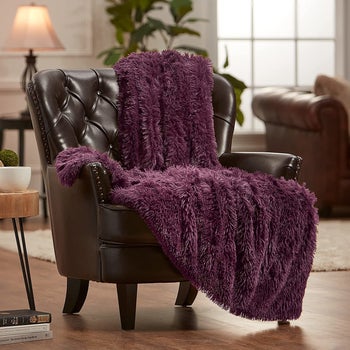 purple blanket on a chair