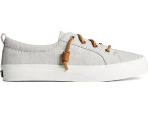 a light gray sneaker with rawhide laces