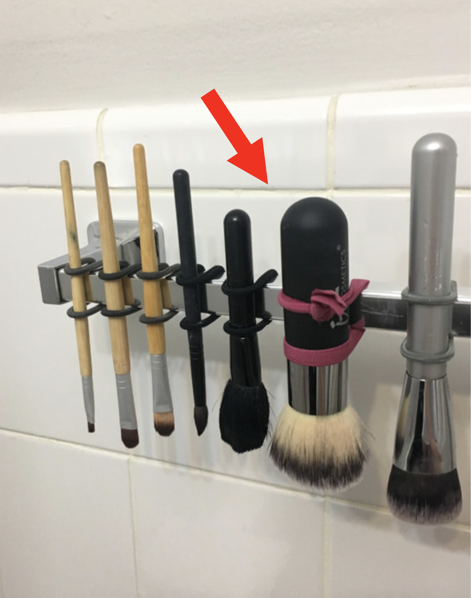 Makeup brushes being hung upside down to dry