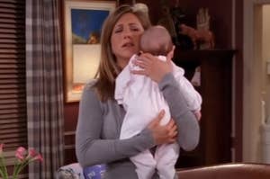 Rachel from Friends holding baby Emma