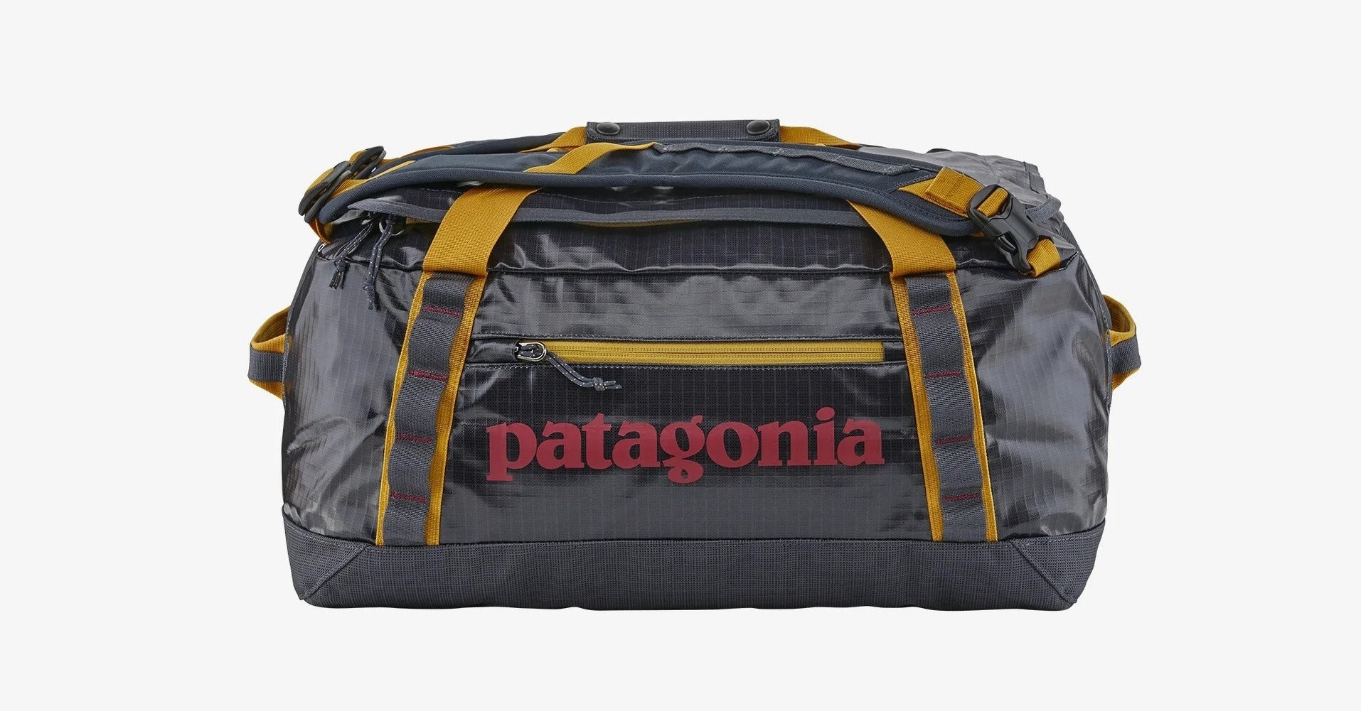 a black duffle bag with yellow accents and the name &quot;patagonia&quot; in red.