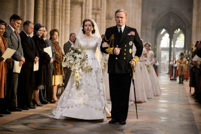 The Queen and her father walk down the aisle