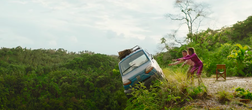 A tiny car falls off a cliff