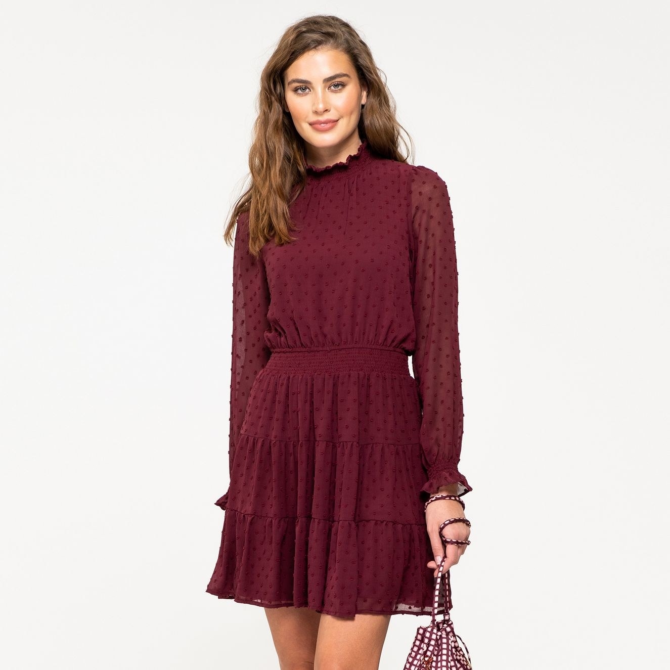 Model wearing the burgundy dress