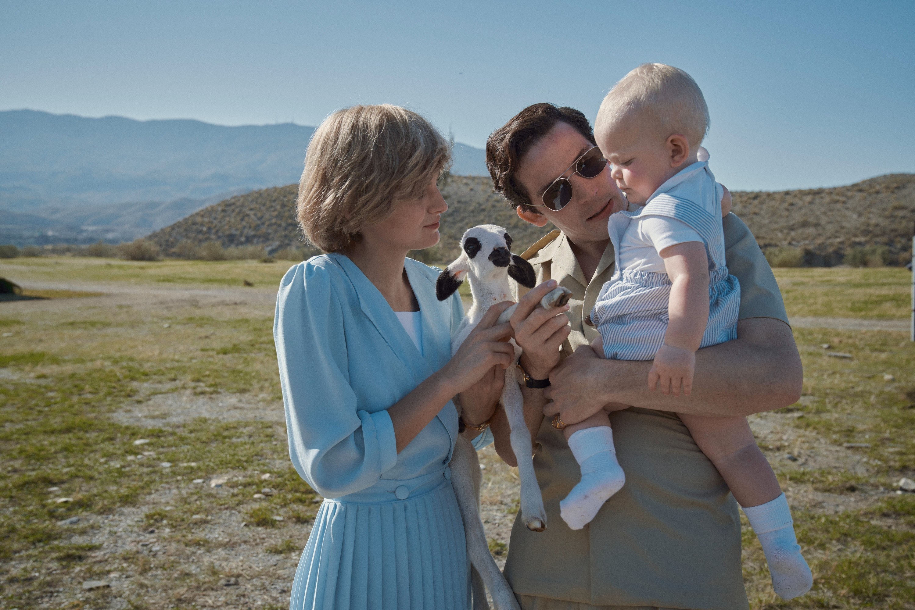 Emma and Josh and a baby in a scene depicting them as the young royal family