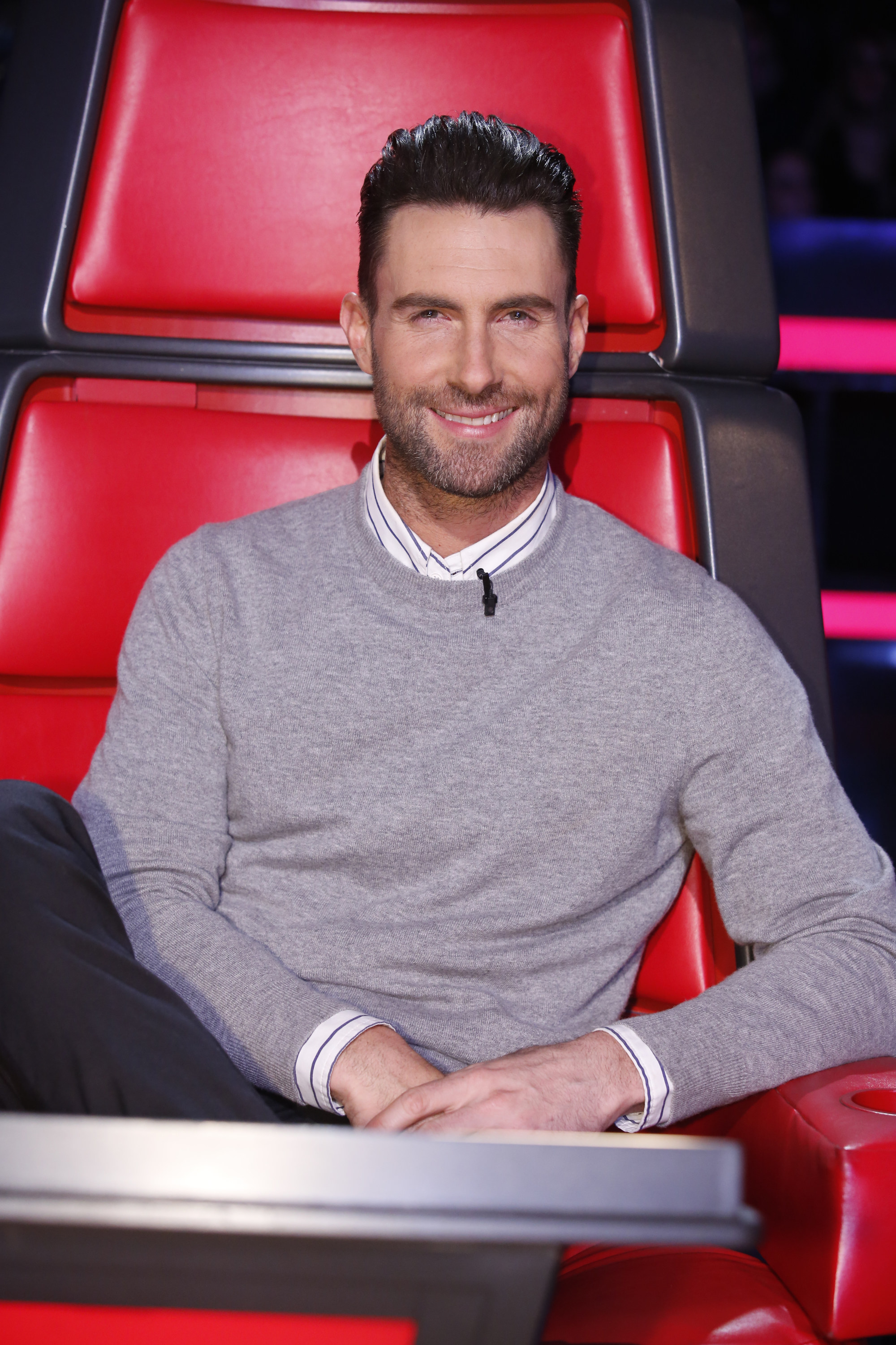 Adam smiles as he sits in the judge&#x27;s chair on the voice