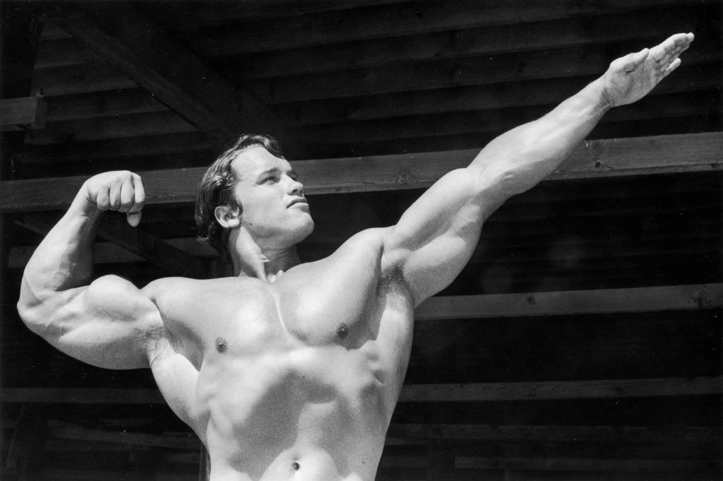 Arnold Schwarzenegger doing a bodybuilding pose