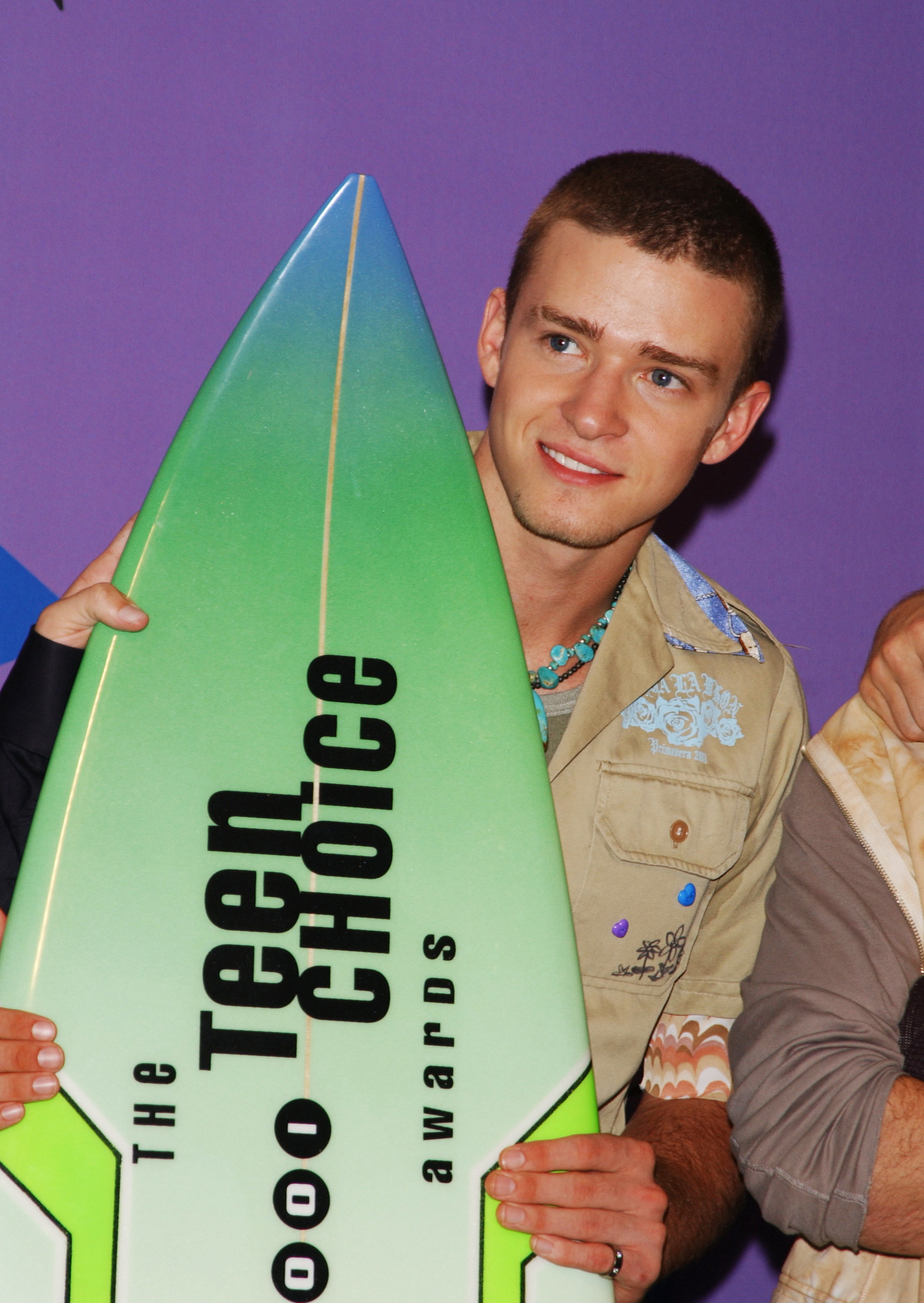 Justin Timberlake holding a surfboard