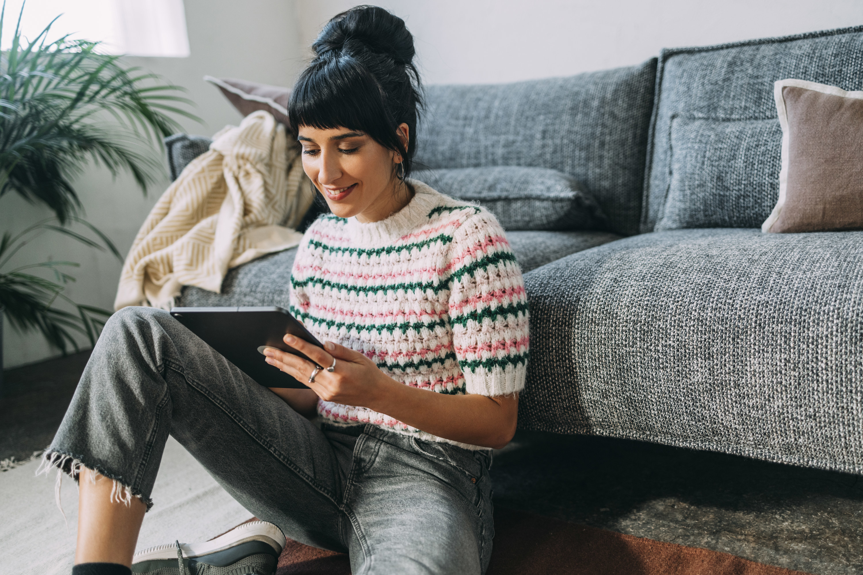 a woman on her ipad inside her home