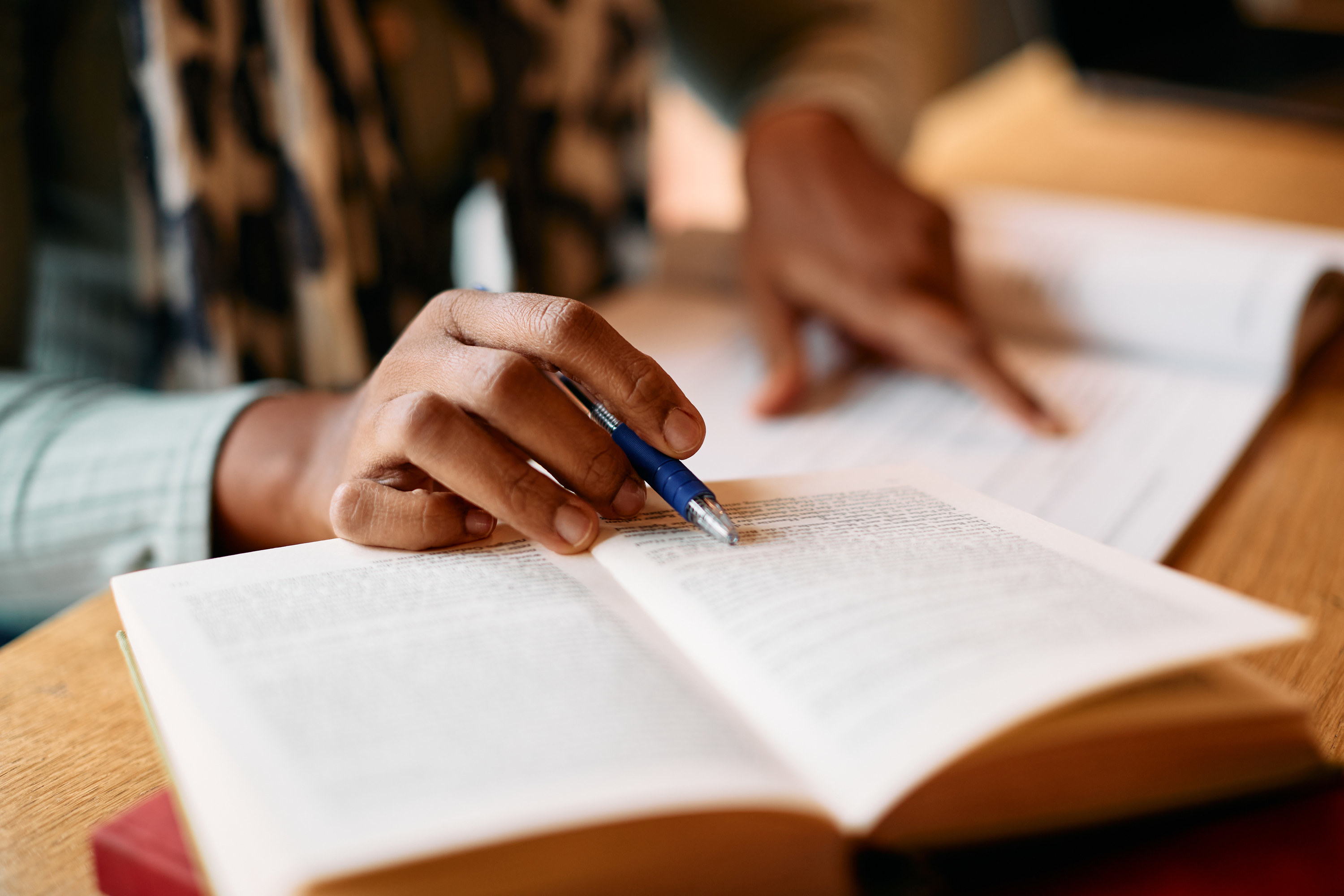 a person studying with a book