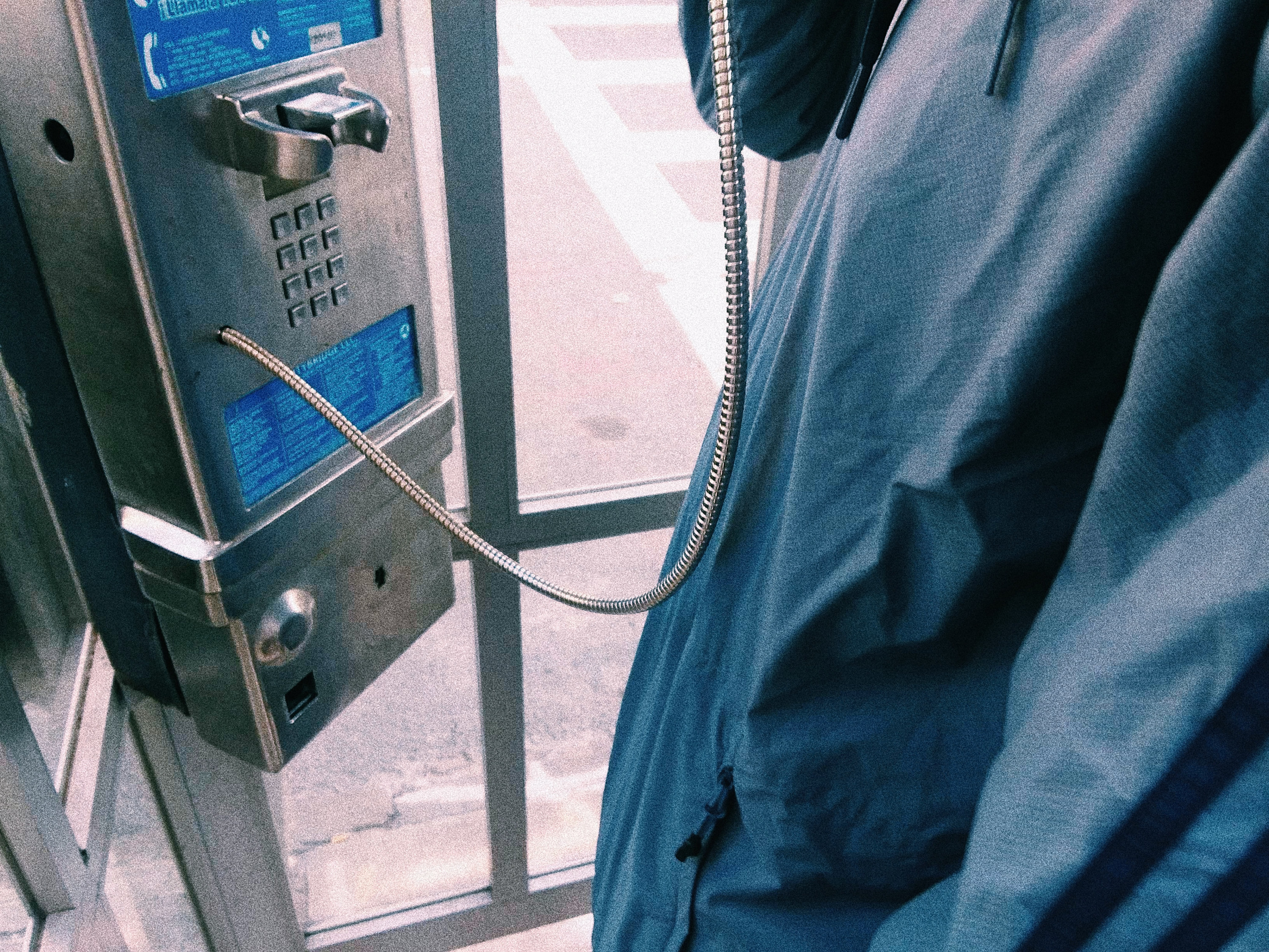 a person using a payphone