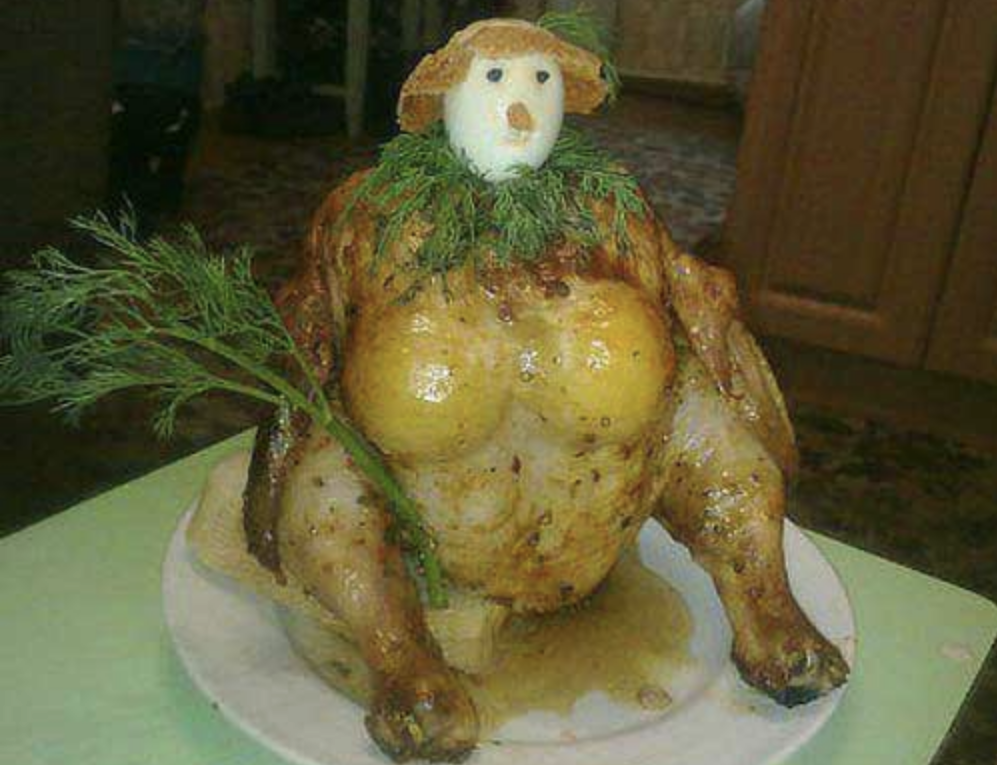 turkey dressed up as a snow person with garnishes to have a hat and face