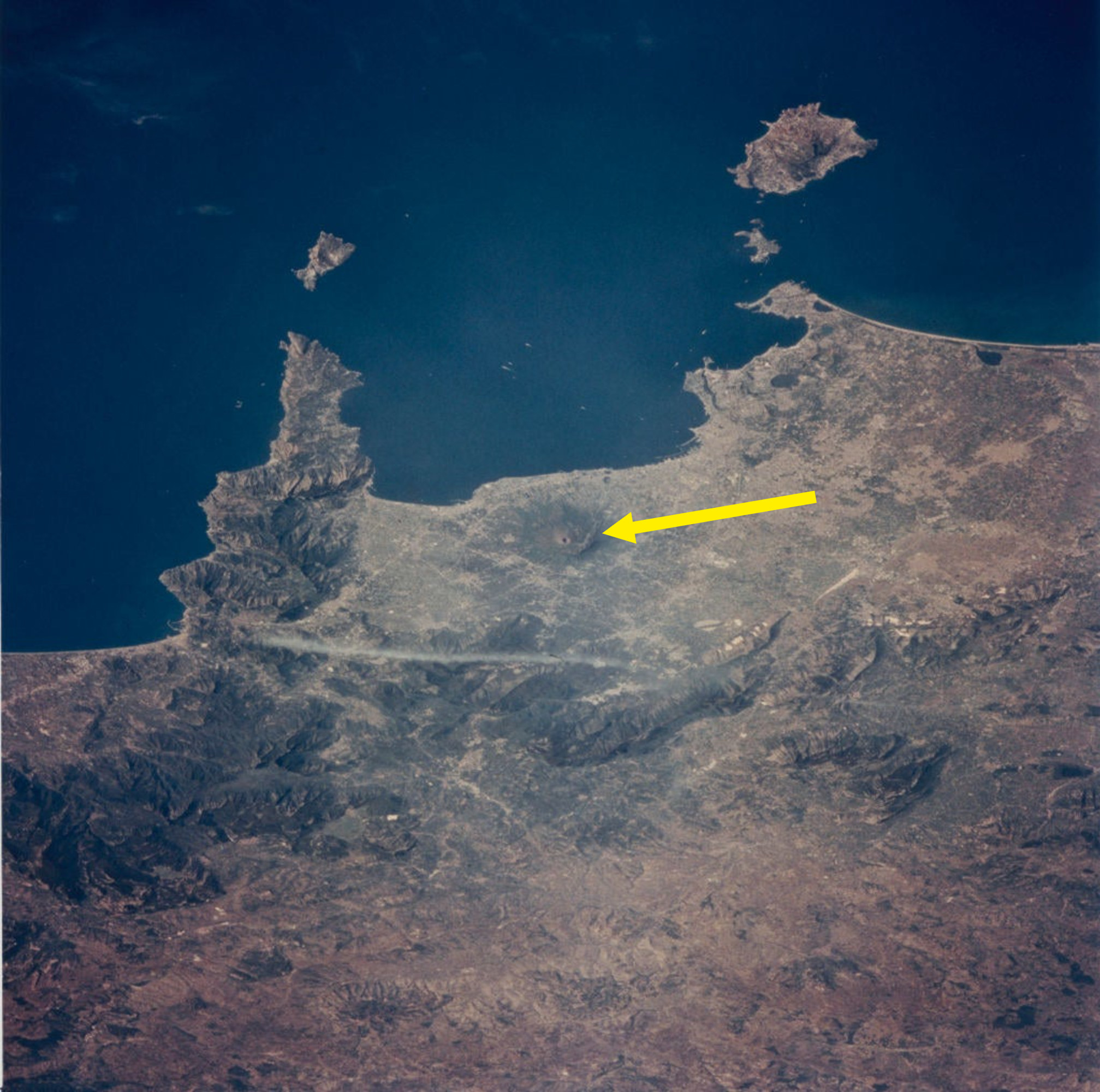 An arrow pointing to a dot on a landscape