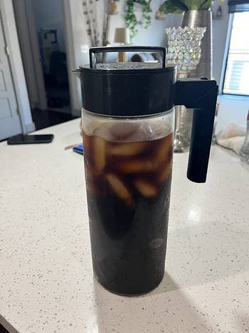 a reviewer's cold brew in a pitcher
