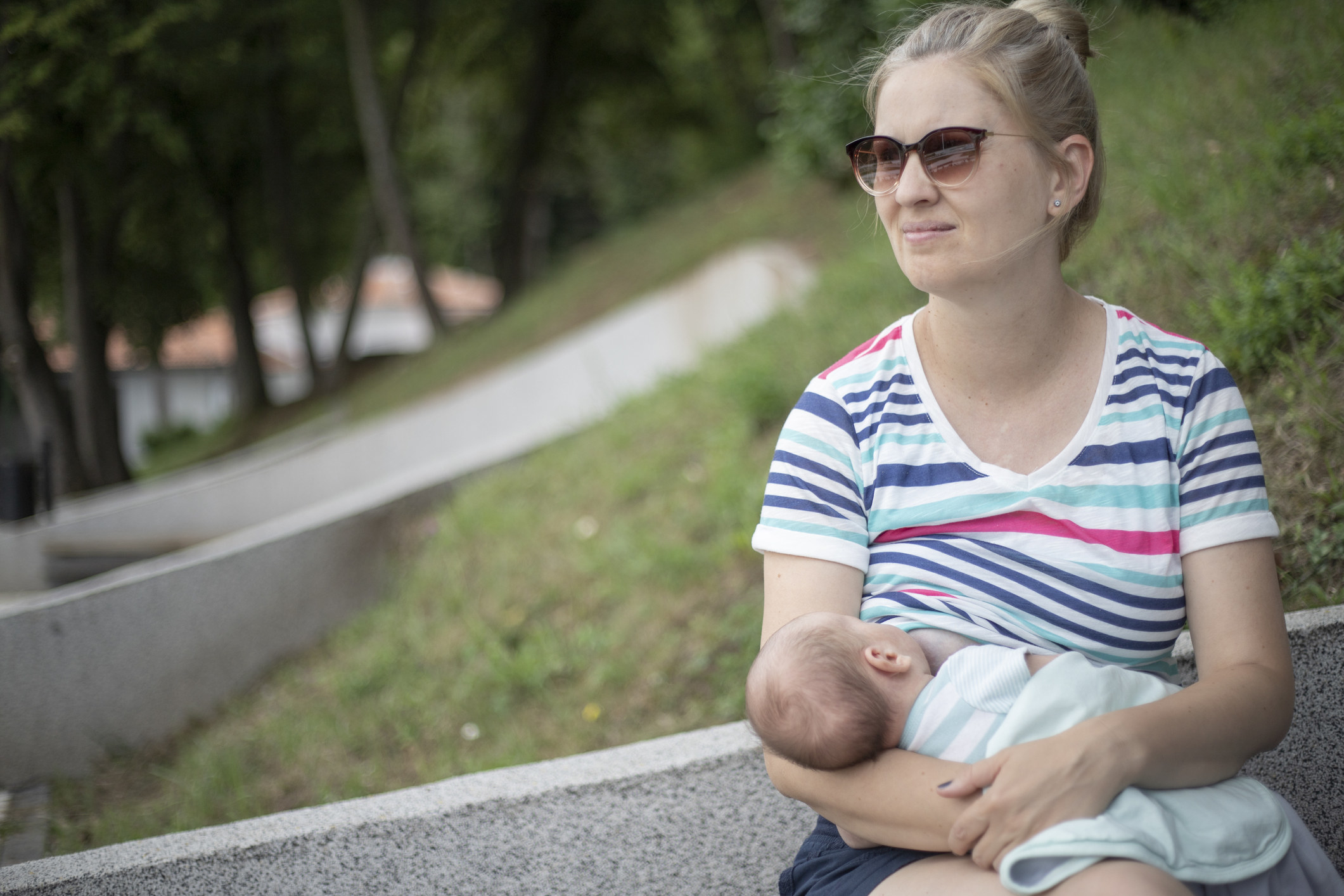 woman breastfeeding outside