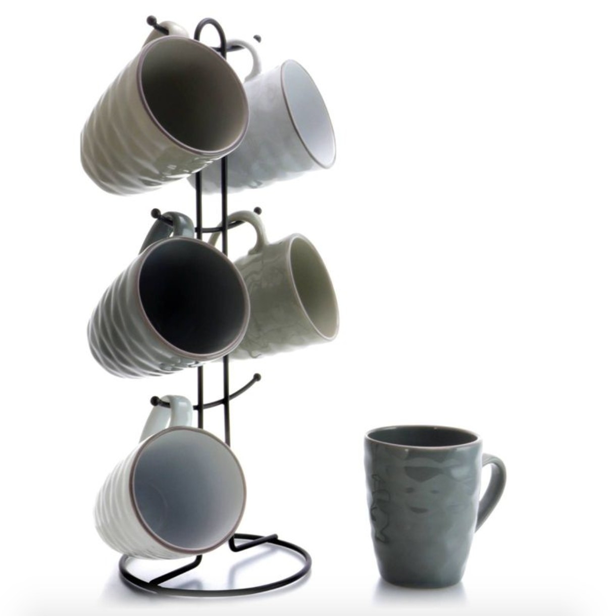 the glazed stoneware mugs in neutral shades hanging on their stand