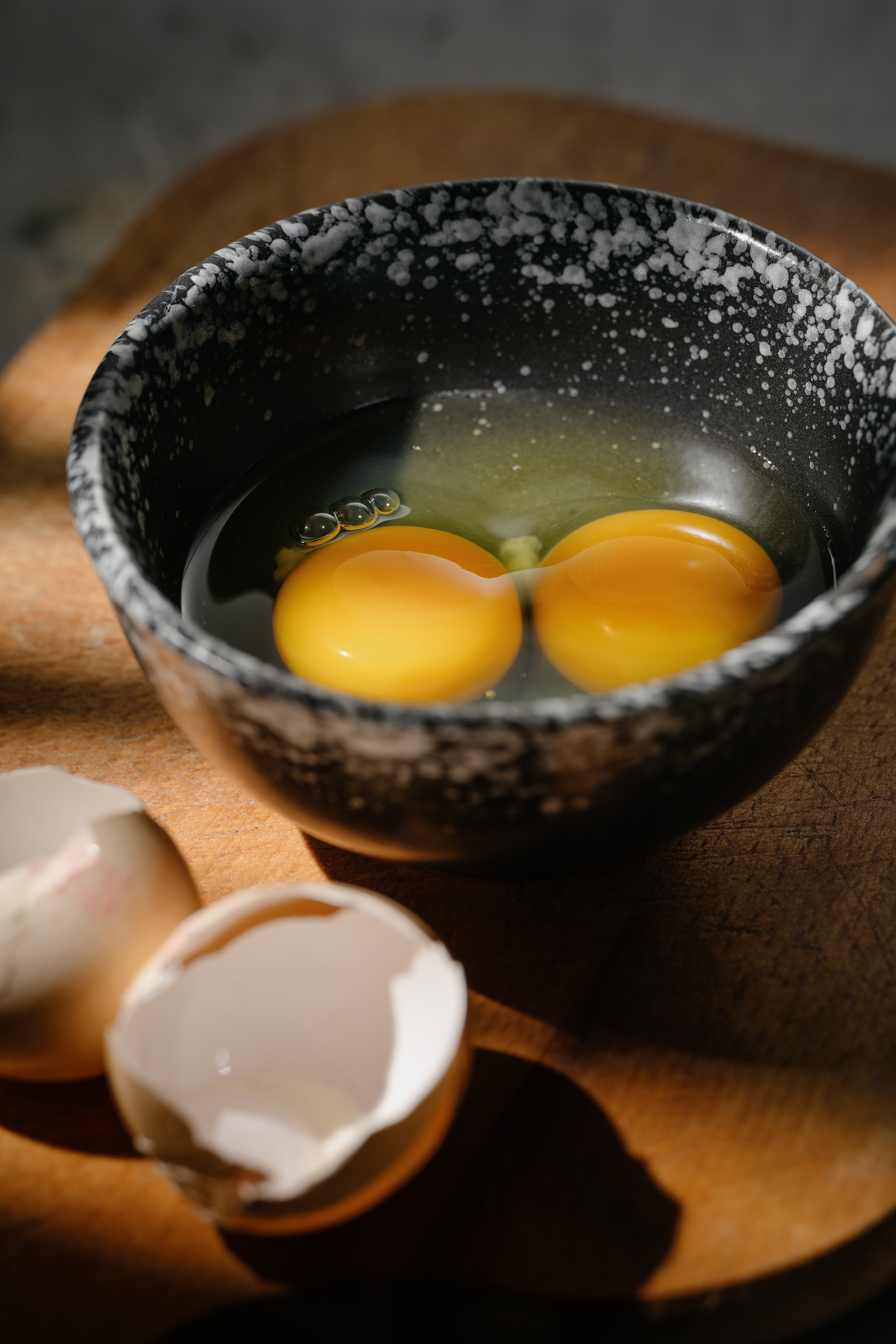 cracked egg yolks in a small bowl
