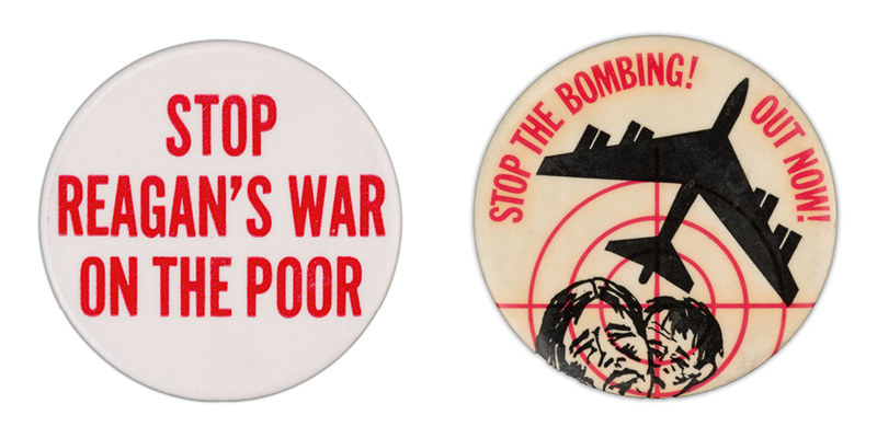 Two campaign buttons: one reads &quot;stop Reagan&#x27;s poor on the war,&quot; the other shows two frowning faces behind red crosshairs, under a warplane taking flight, and has the words: &quot;stop the bombing! out now!&quot;