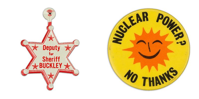A button resembling a sheriff&#x27;s badge reads &quot;Deputy Buckley for Sheriff&quot; beside a button with an simple orange smiling sun image encircled with the words &quot;nuclear power? no thanks&quot;