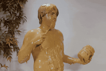 A man covered in peanut butter