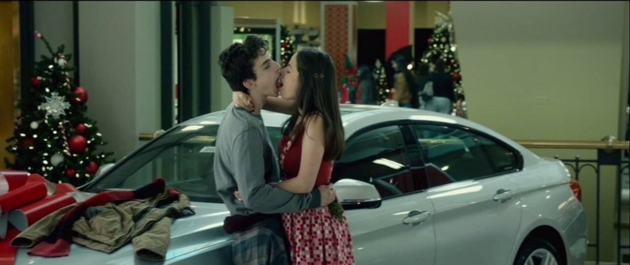 Timothee Chalamet and Molly Gordon make out against a car
