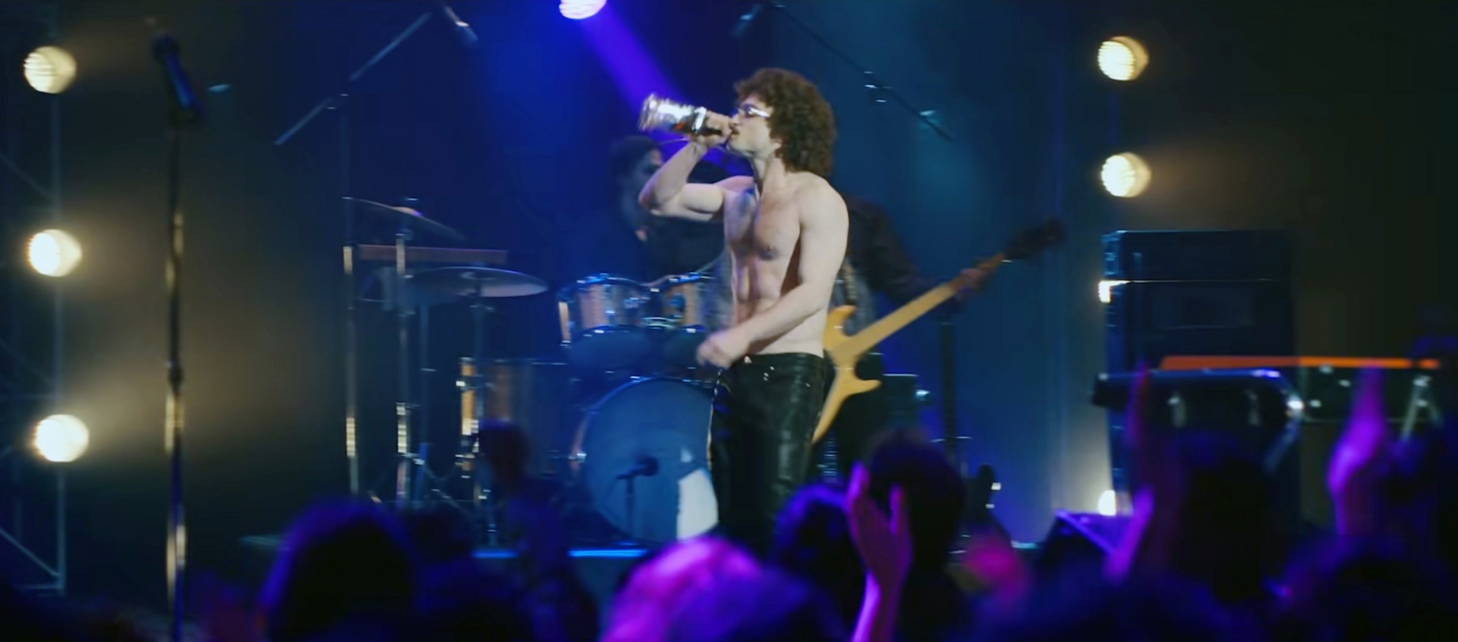 Radcliffe as Weird Al drinking onstage