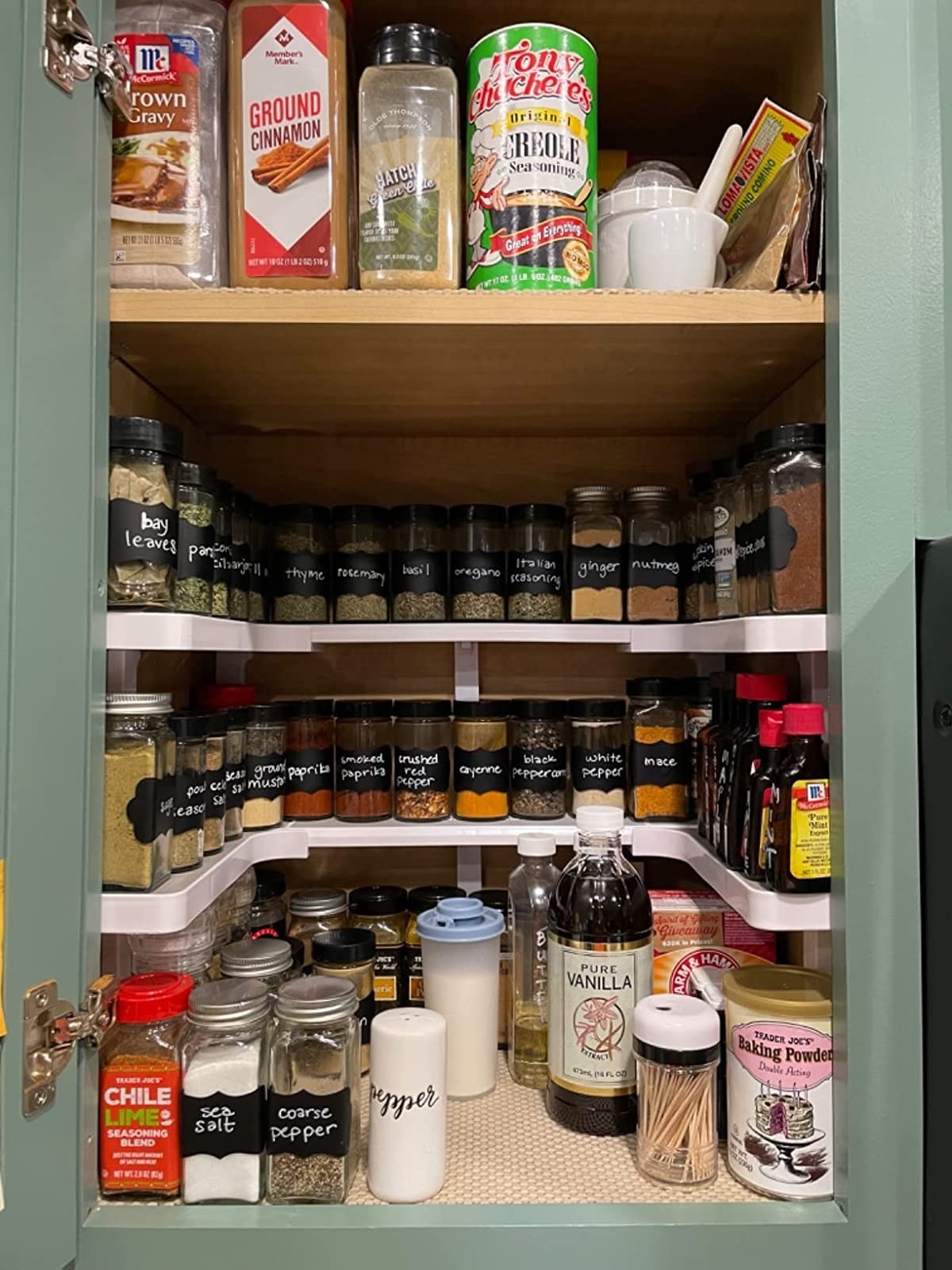 reviewr photo of the shelving system used to organize a spice cabinet