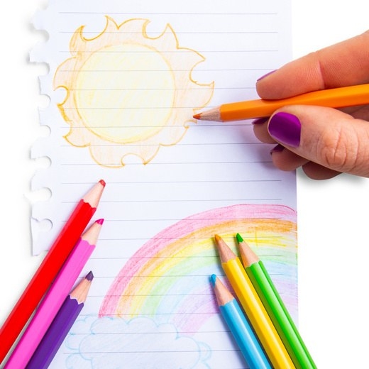Colored pencils being used to draw a picture