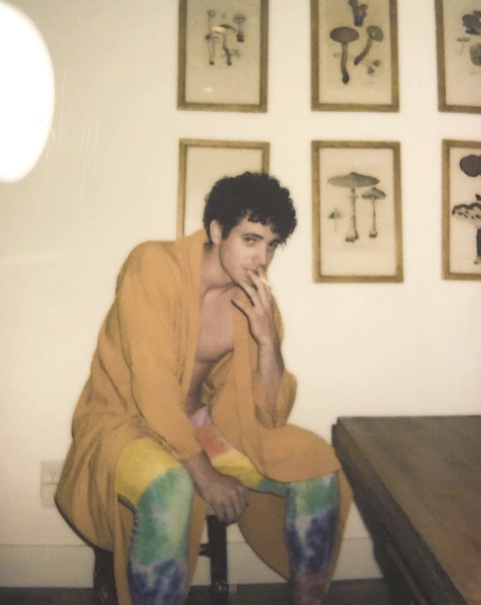 abe in a chair with colorful pants