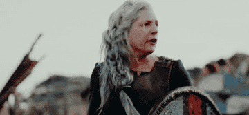 An older viking woman attempts to rally her soldiers during a skirmish