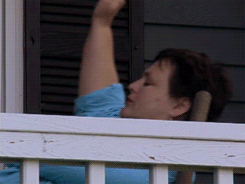 someone rocking on their porch with their arm raised like hallelijah