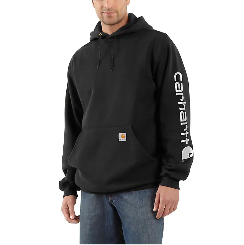 model wearing black hoodie that says carhartt in white on the side of the arm
