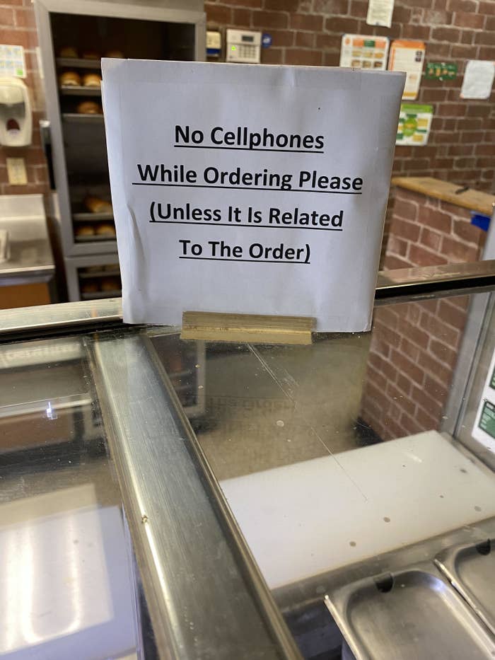 sign saying don&#x27;t use your cellphone while ordering