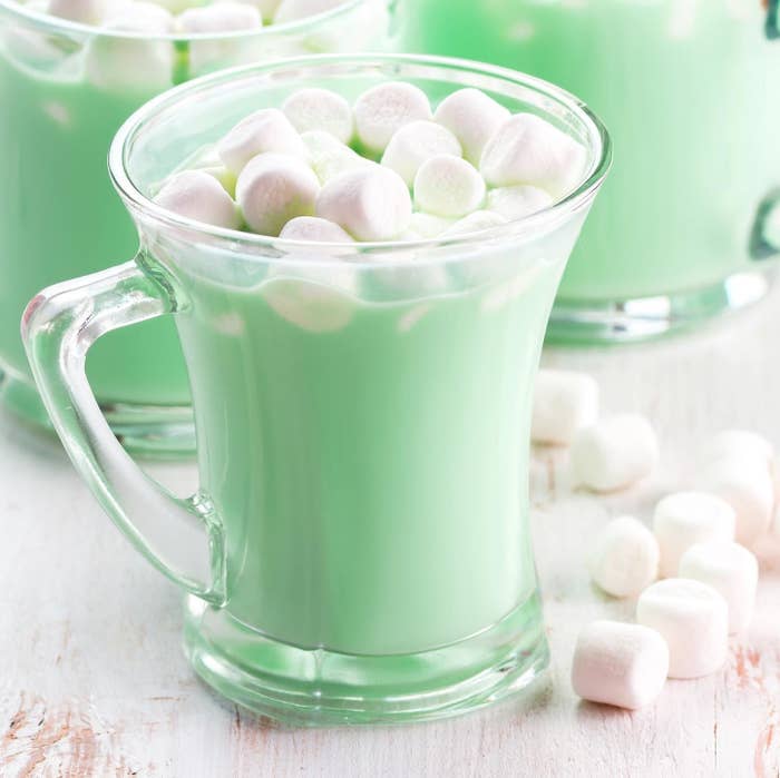 a glass mug with the hot chocolate and marshmallows in it