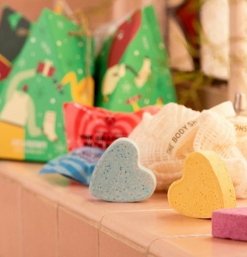 the heart-shaped bath bombs on a ledge in a bathroom