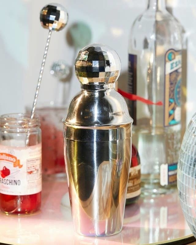 a shiny cocktail shaker on a bar cart