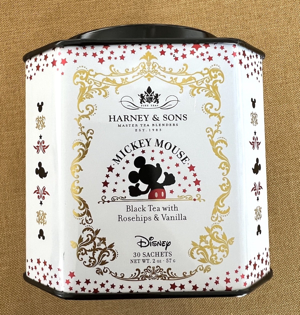 a white tin of tea with mickey mouse on it
