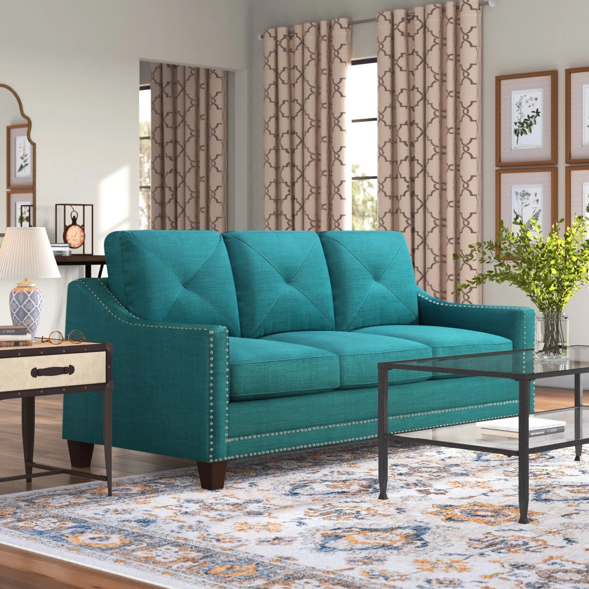 a teal sofa with metal tufts in a cozy living room