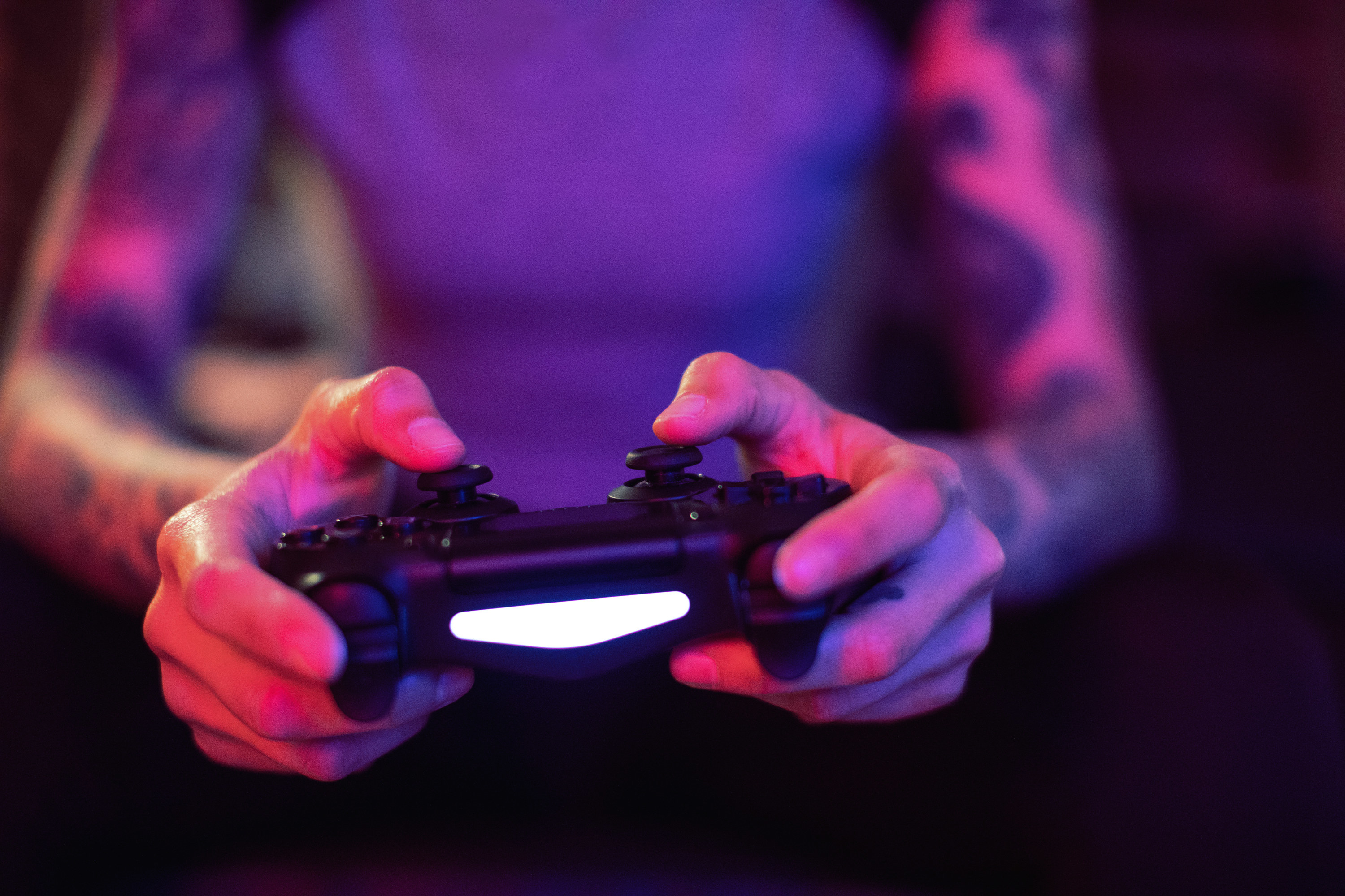 a person playing with a PS5 controller