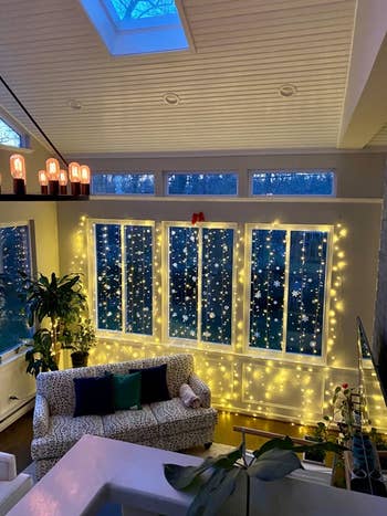 Reviewer's living room with warm white fairy lights hung in the window