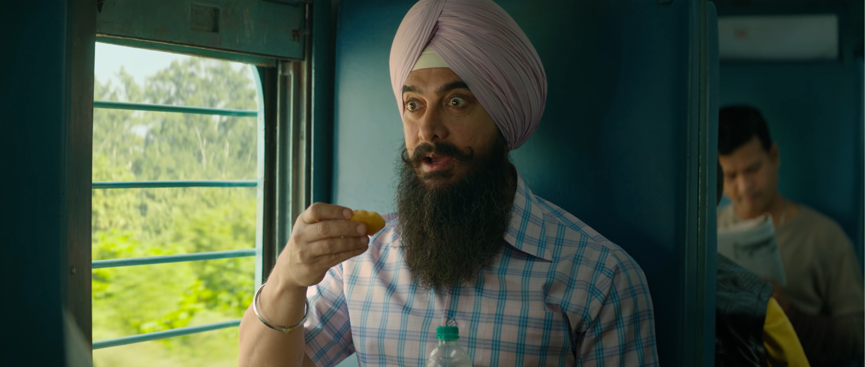 Aamir Khan wearing a turban and eating a gol gappa